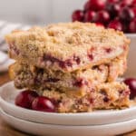 3 cranberry cream cheese bars on a plate