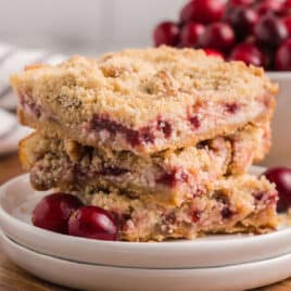 3 cranberry cream cheese bars on a plate