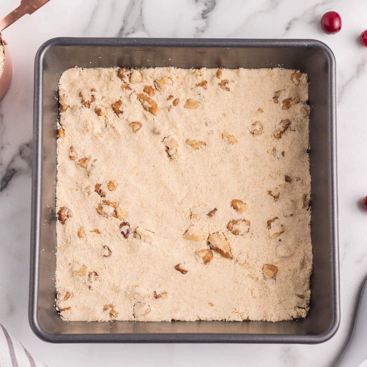 walnut shortbread crust pressed into a pan