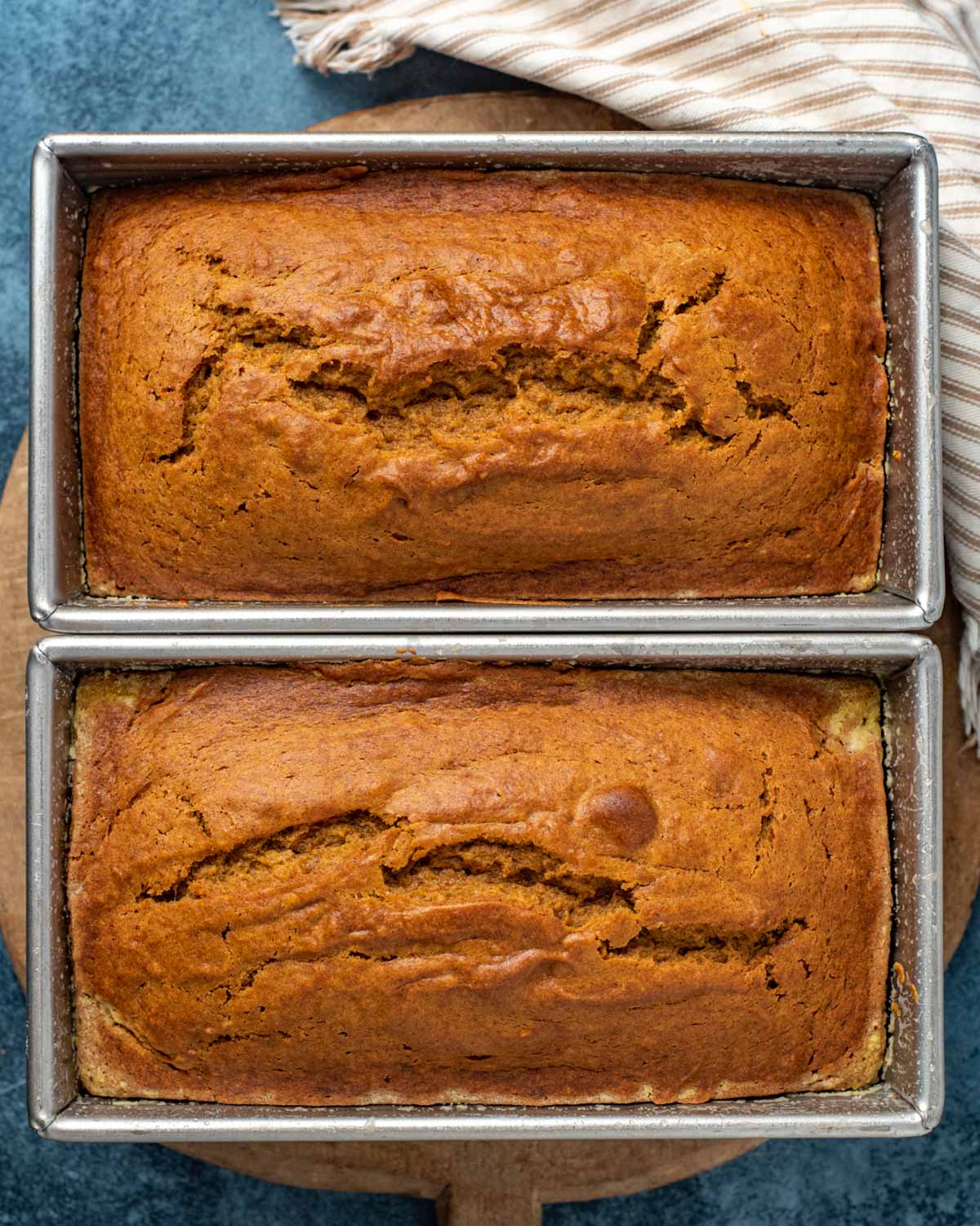 two loaves of easy pumpkin bread in pans