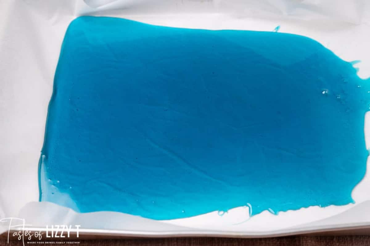 blue sugar candy hardened in a sheet on a pan