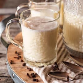 closeup of a cup of homemade eggnog with nutmeg