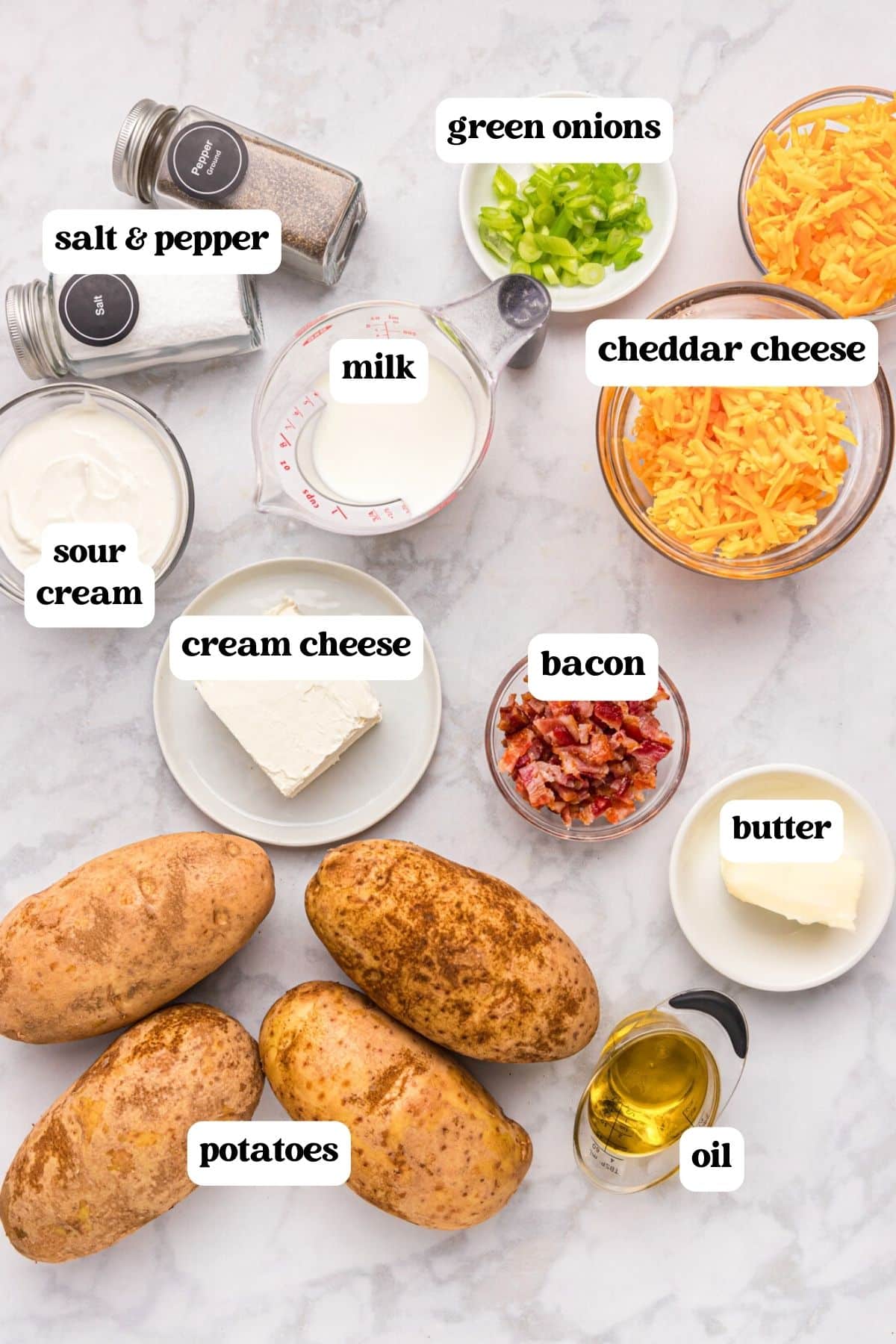 ingredients for twice baked potatoes on a table