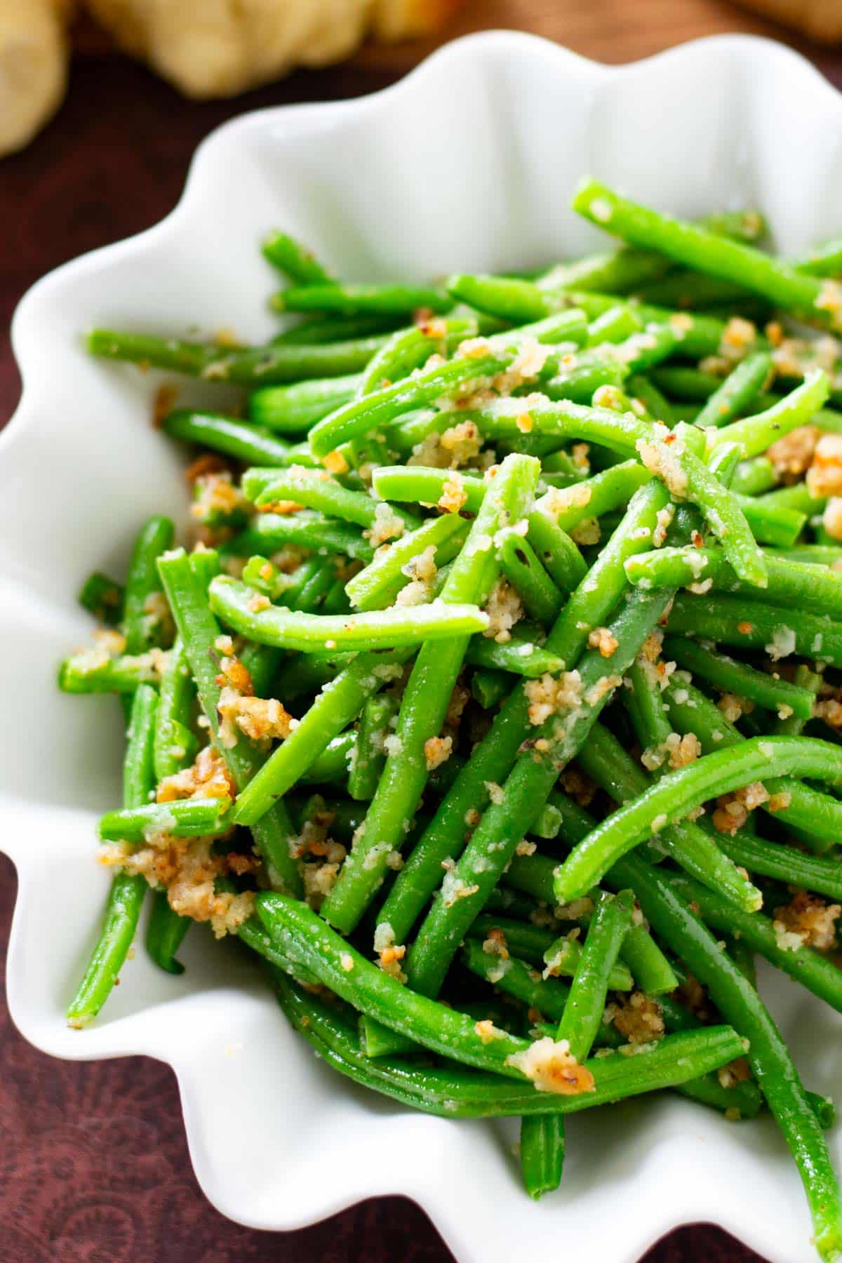 green beans with bread crumbs and parmesan in a bowl