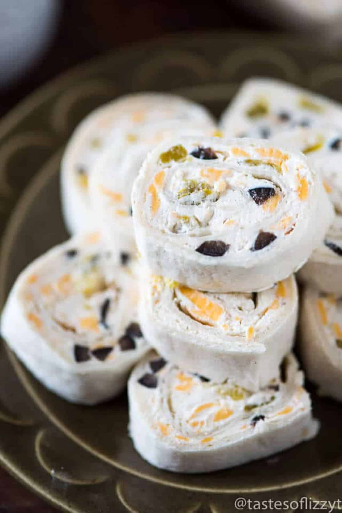 a stack of mexican tortilla rollups on a plate