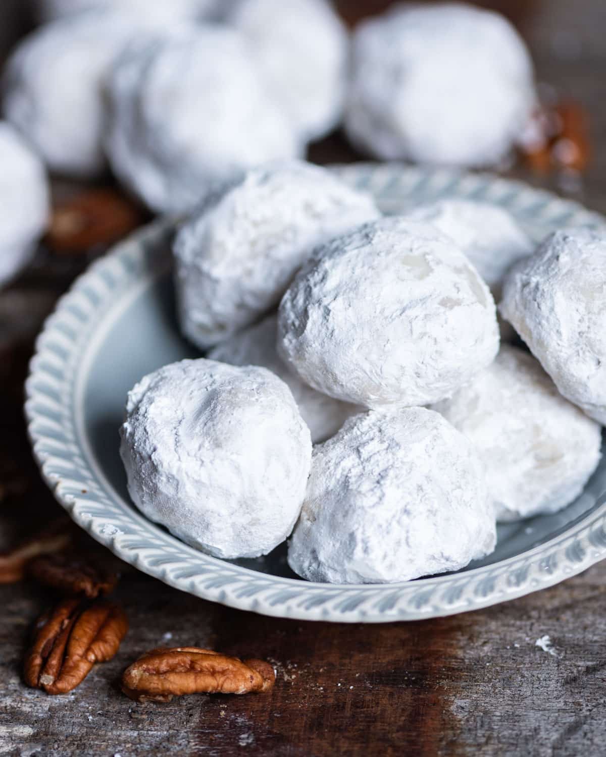 a small bowl of mexican wedding cookies