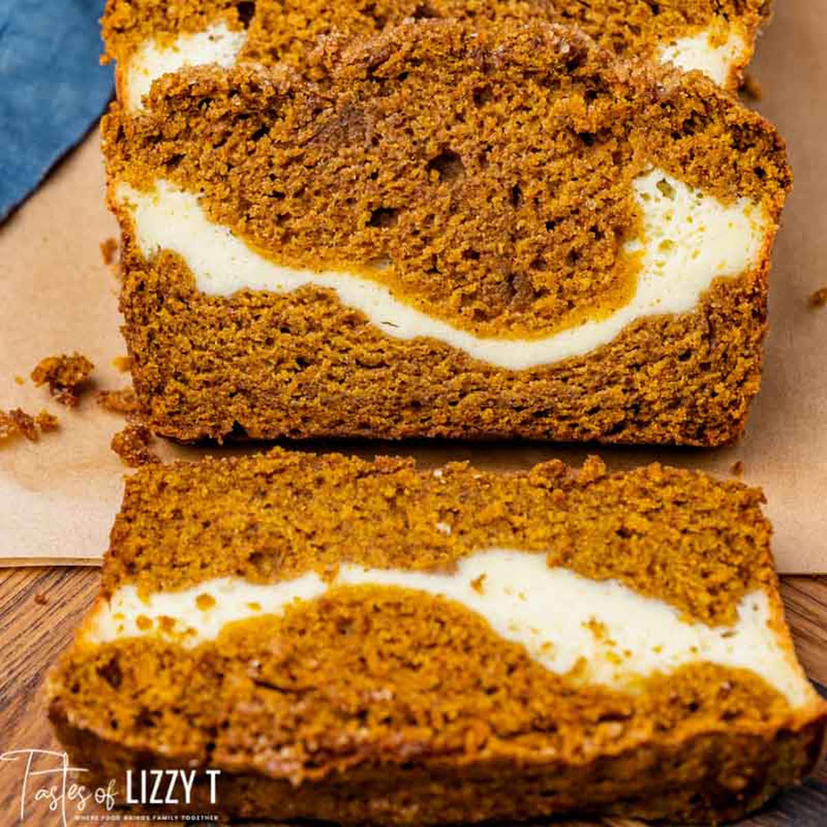 pumpkin bread with cream cheese swirl inside on a table