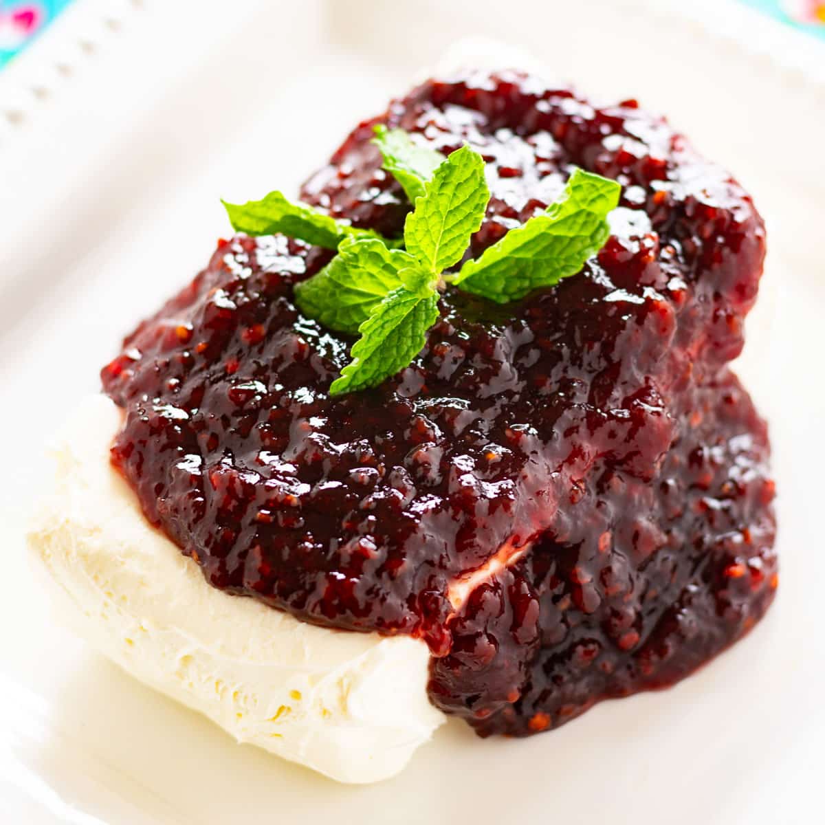 jam over cream cheese on a plate