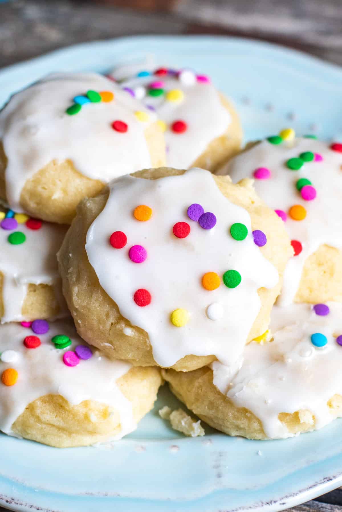 a plate of ricotta sugar cookies with sprinkles