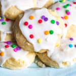 a plate of ricotta cookies with sprinkles