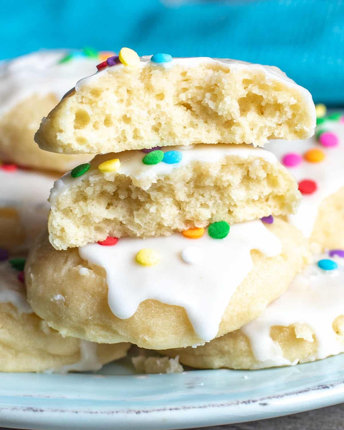 a sugar cookie cut in half on a plate