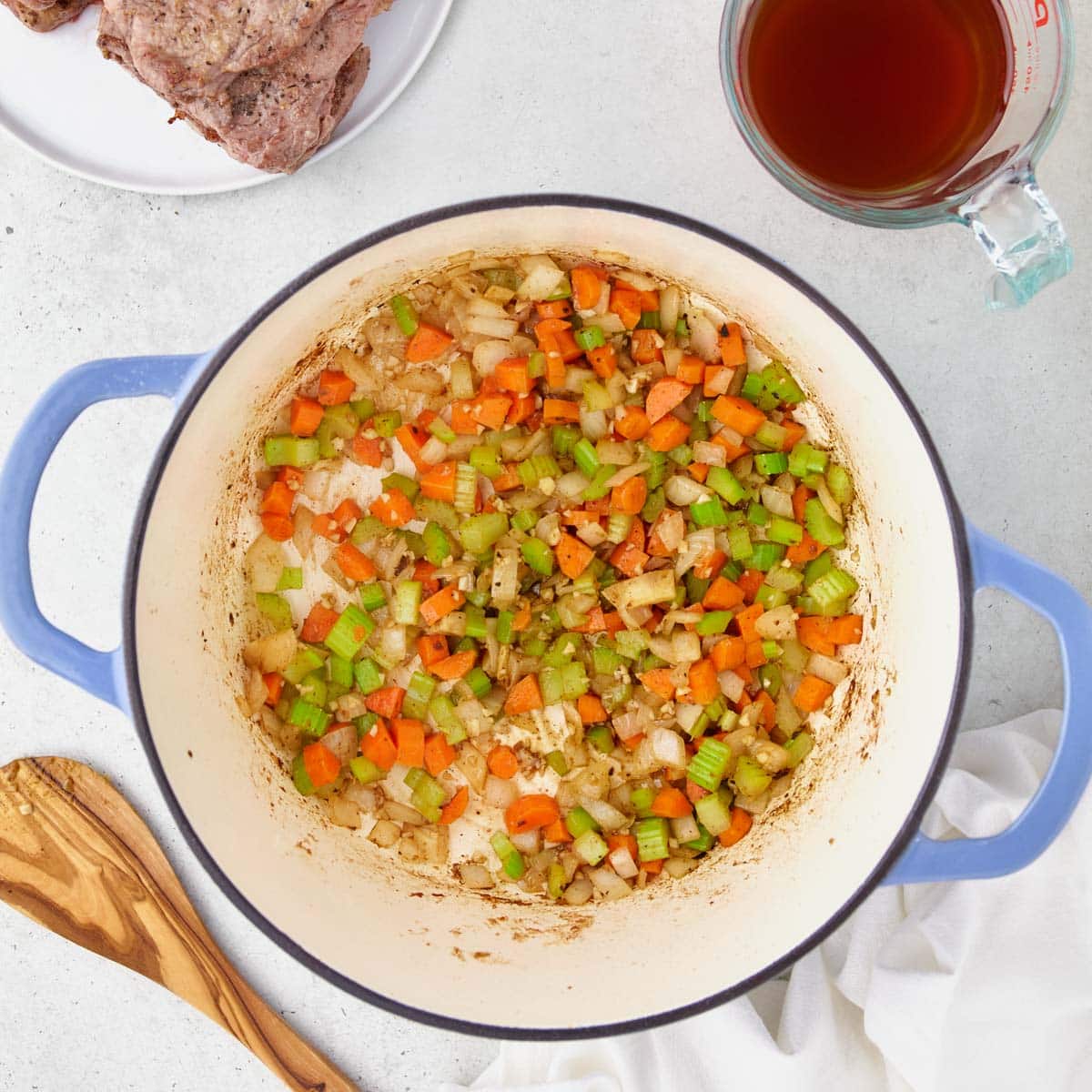 celery, onions and carrots in a dutch oven