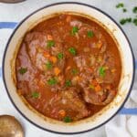 overhead view of swiss steak in a dutch oven