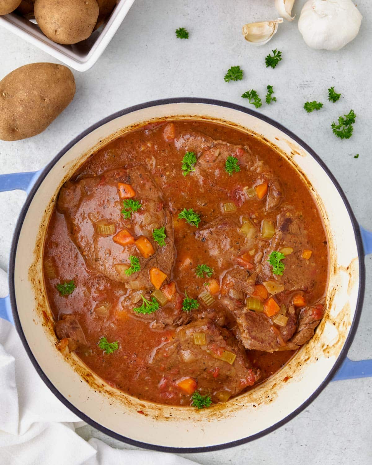 overhead view of swiss steak in a dutch oven