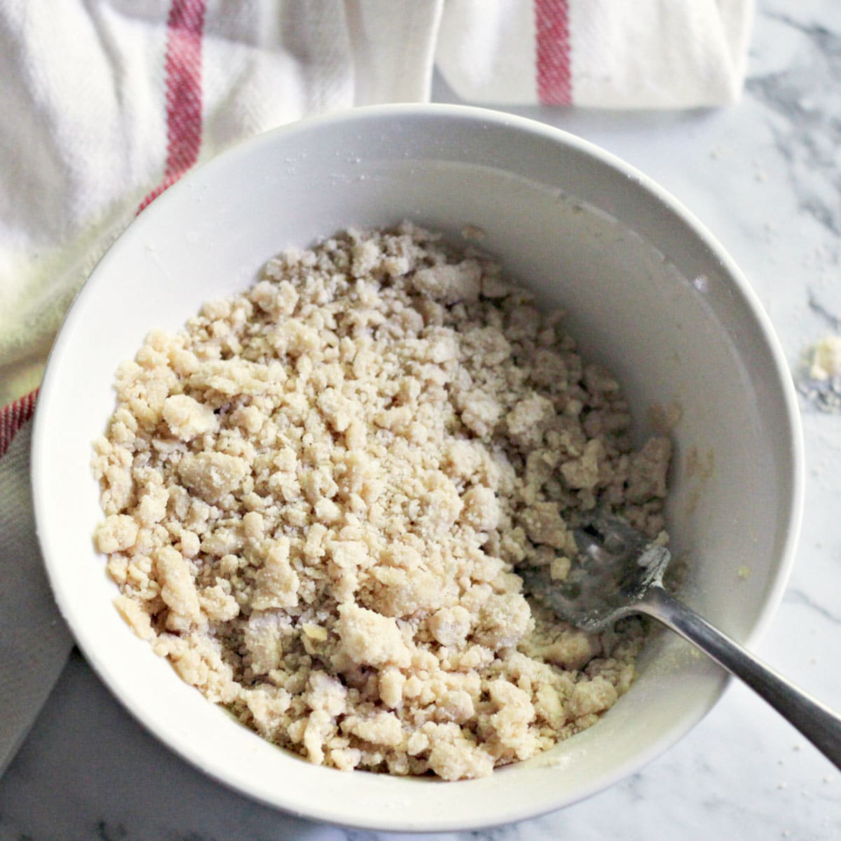 crumble topping in a bowl with a fork