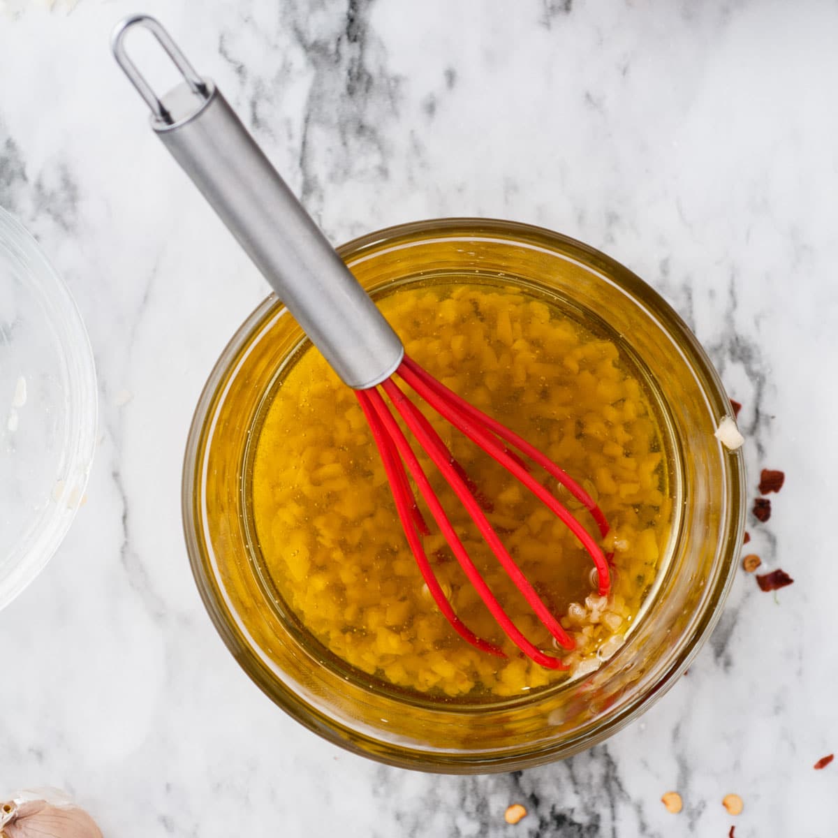 olive oil with seasonings in a glass cup