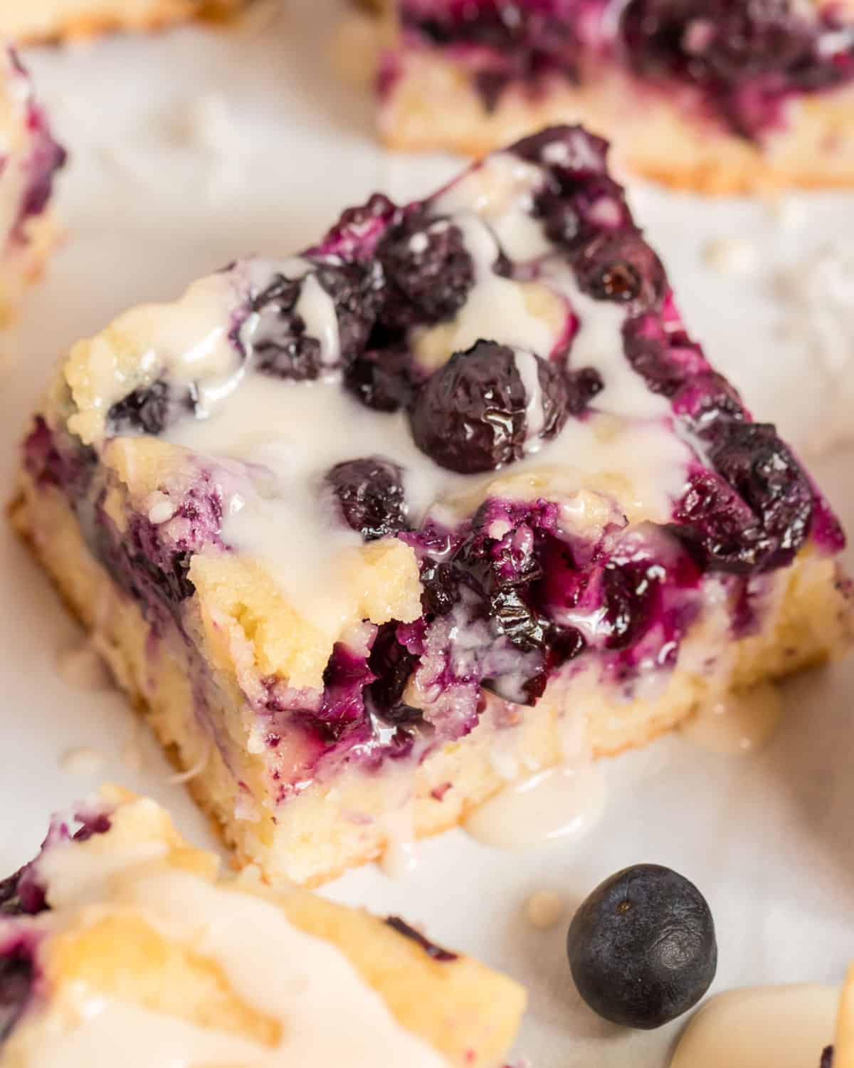 overhead view of blueberry coconut bars with glaze