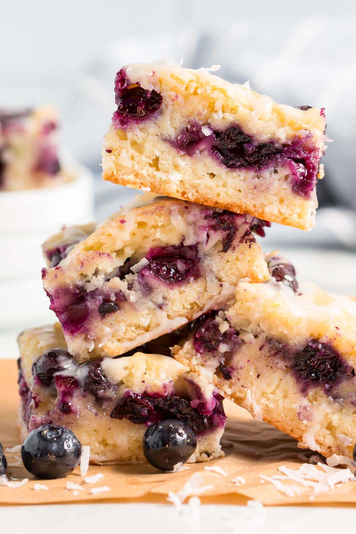 a stack of blueberry bars with coconut