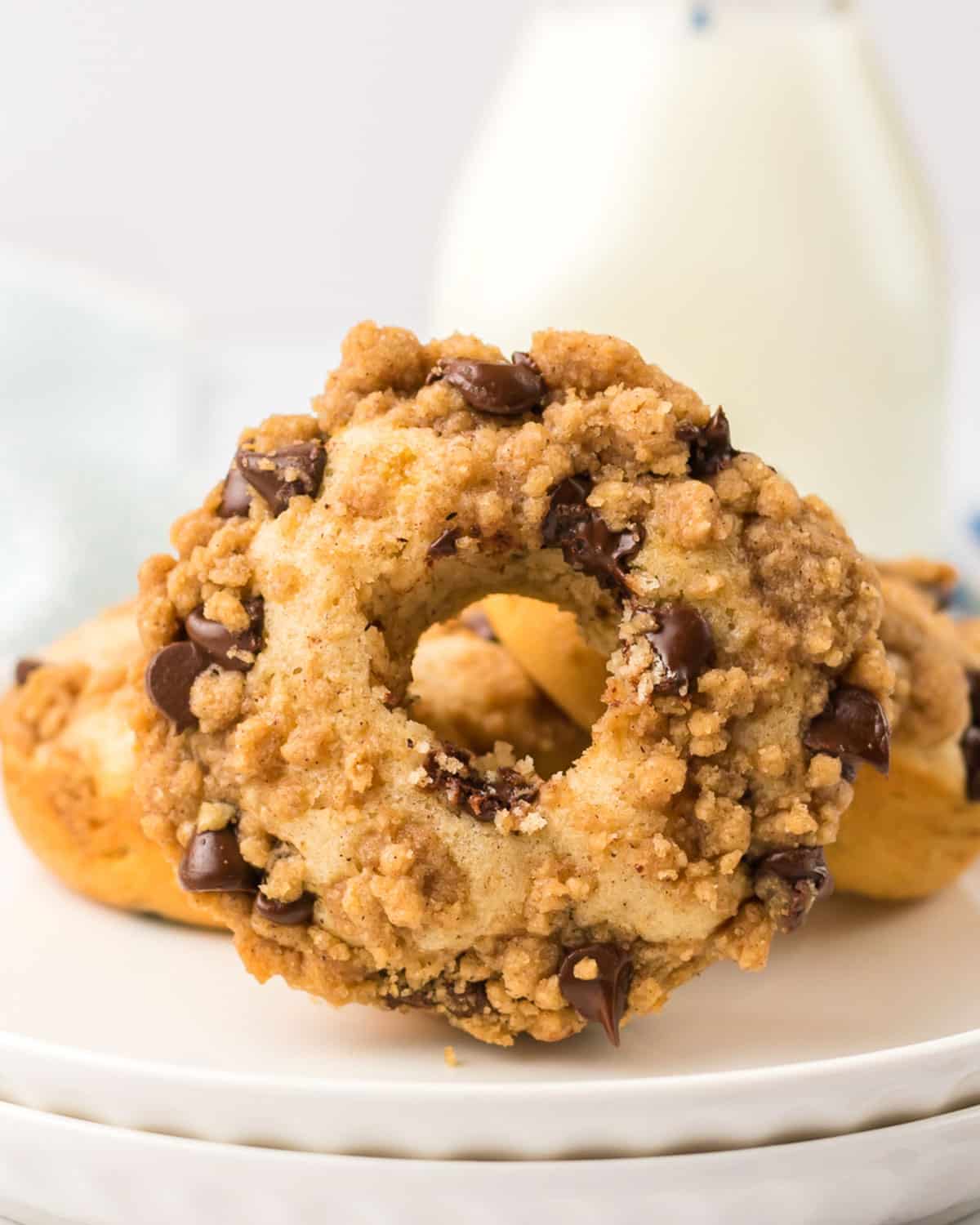 chocolate chip donut with milk on a table