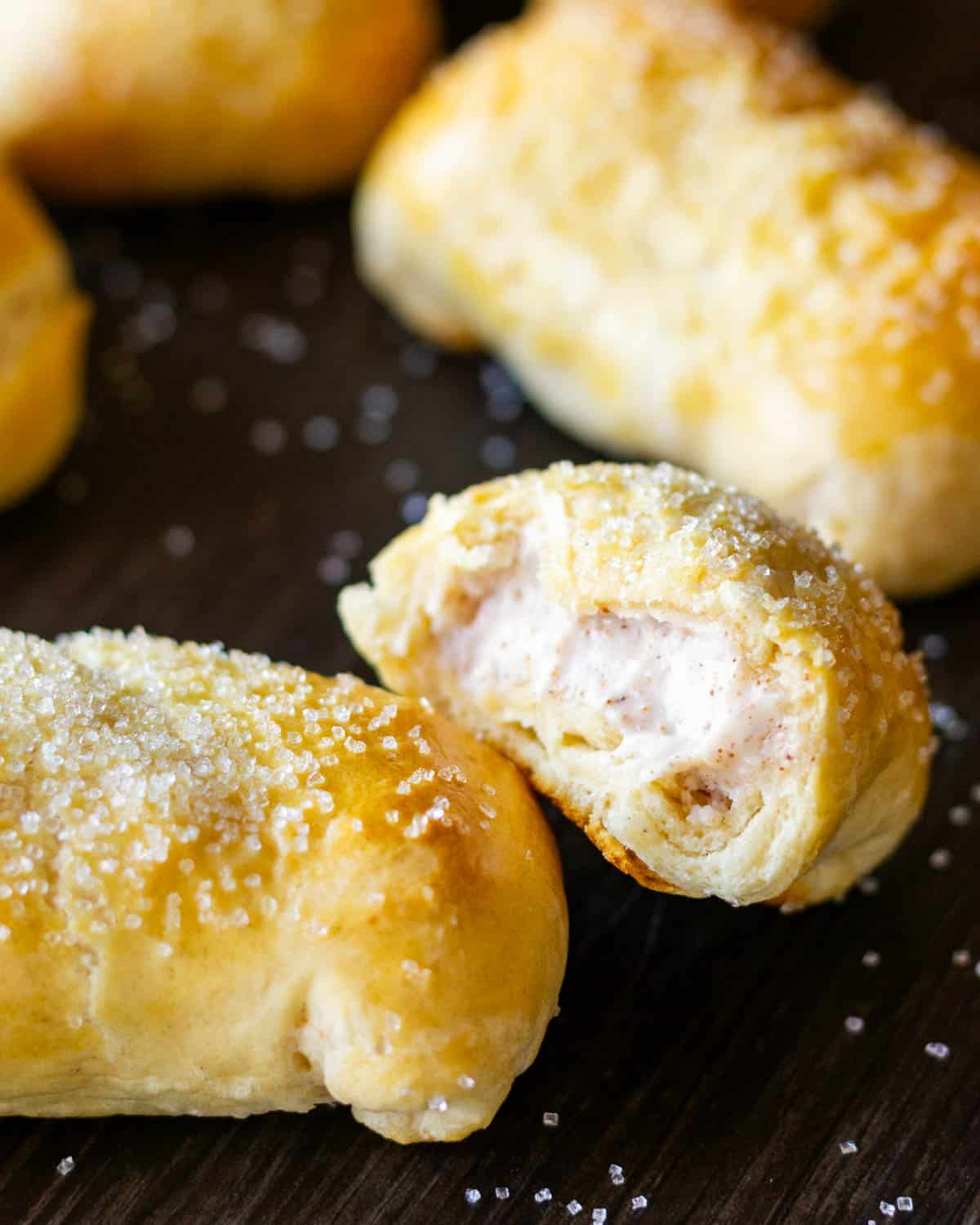 cream cheese pastry puffs with one broken in half