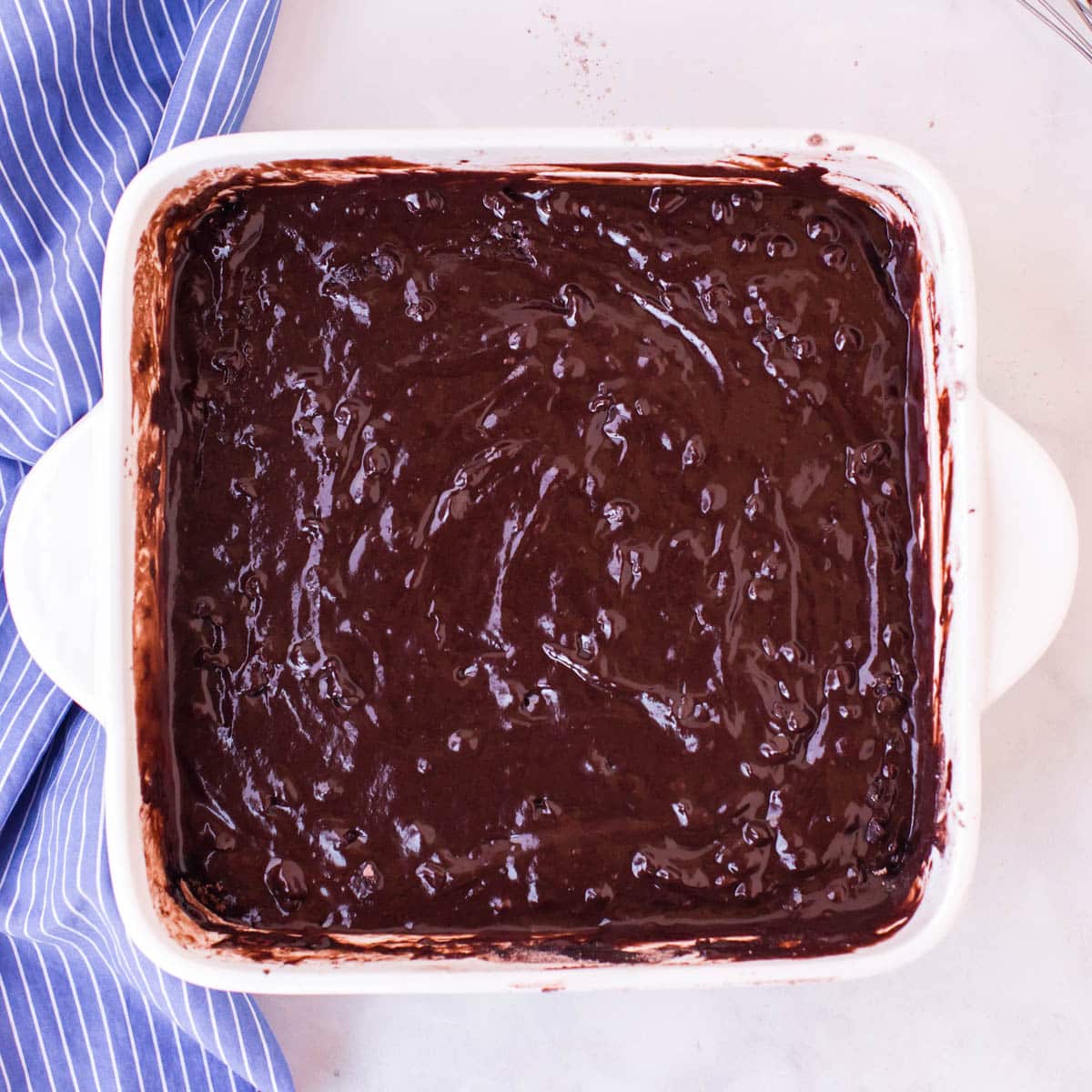 unbaked chocolate cake in a pan