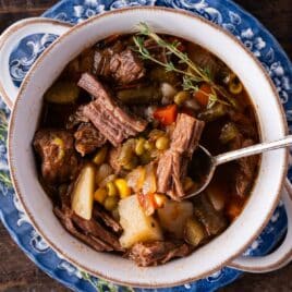 closeup of a bowl of vegetable beef soup with roast beef