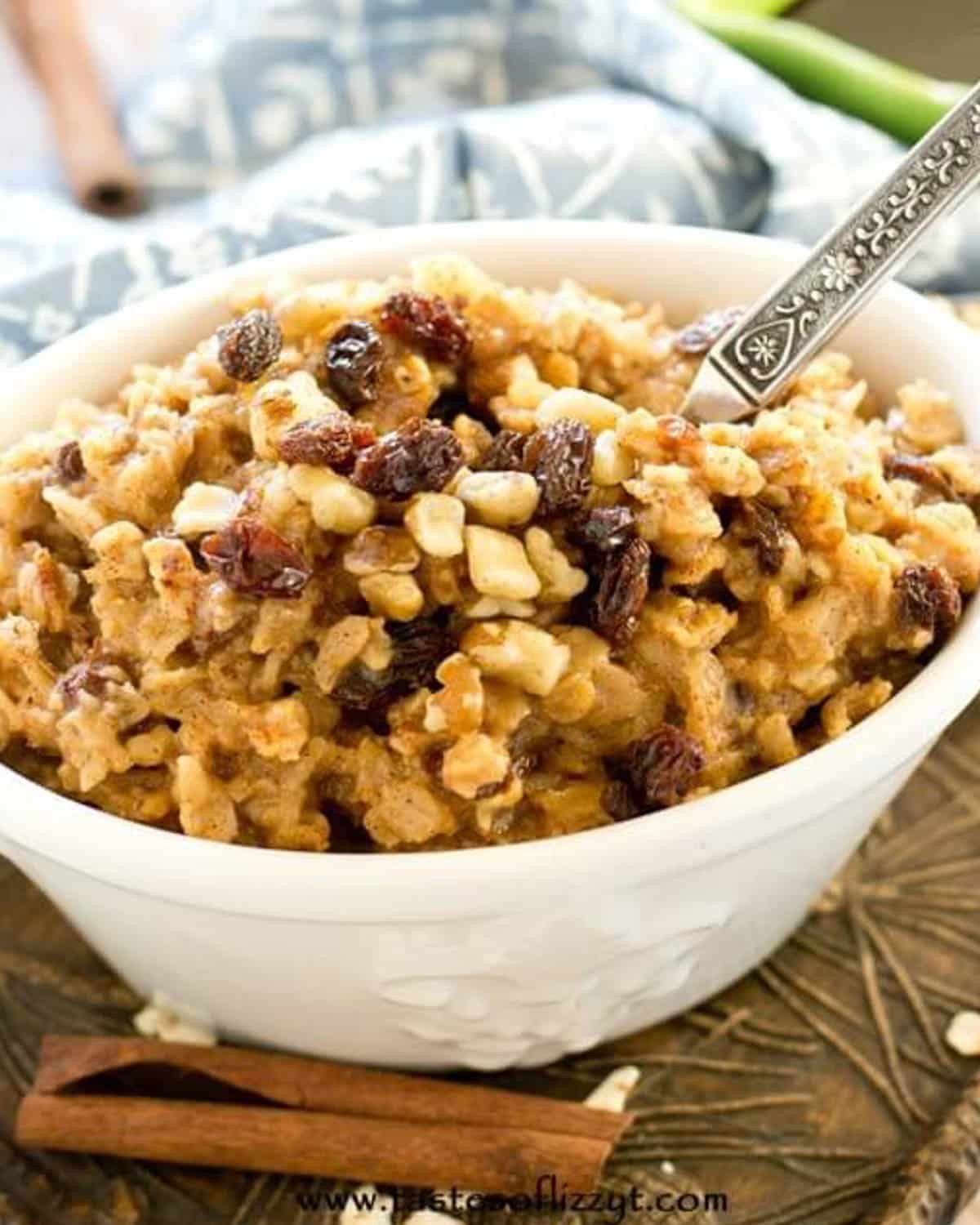 a bowl of hearty oatmeal with nuts and raisins