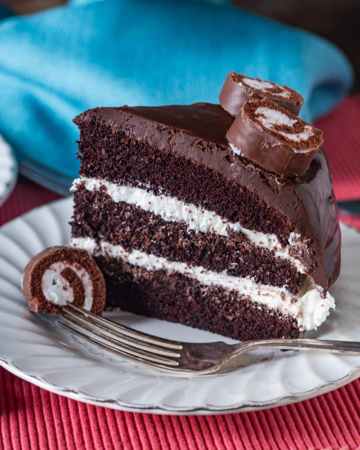 a piece of ho ho cake on a plate with a fork