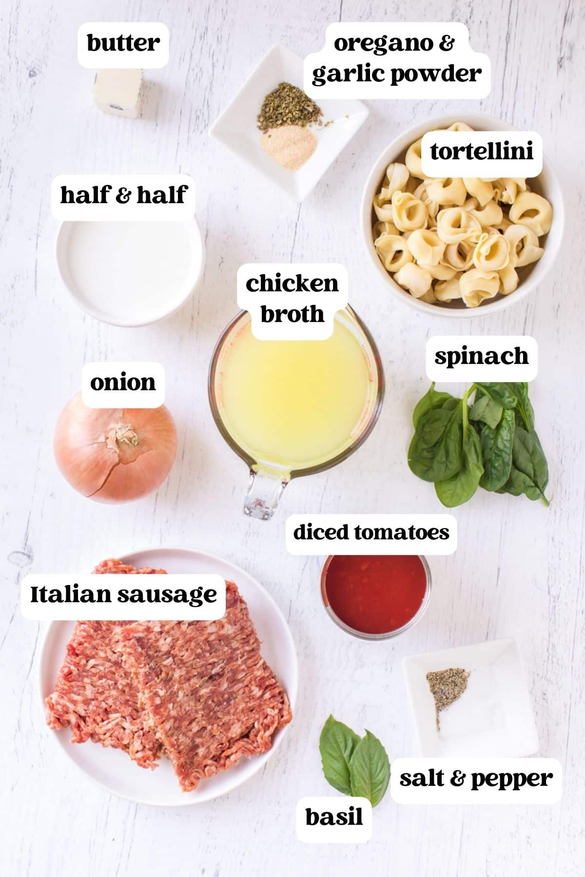 ingredients for creamy tortellini soup on a table