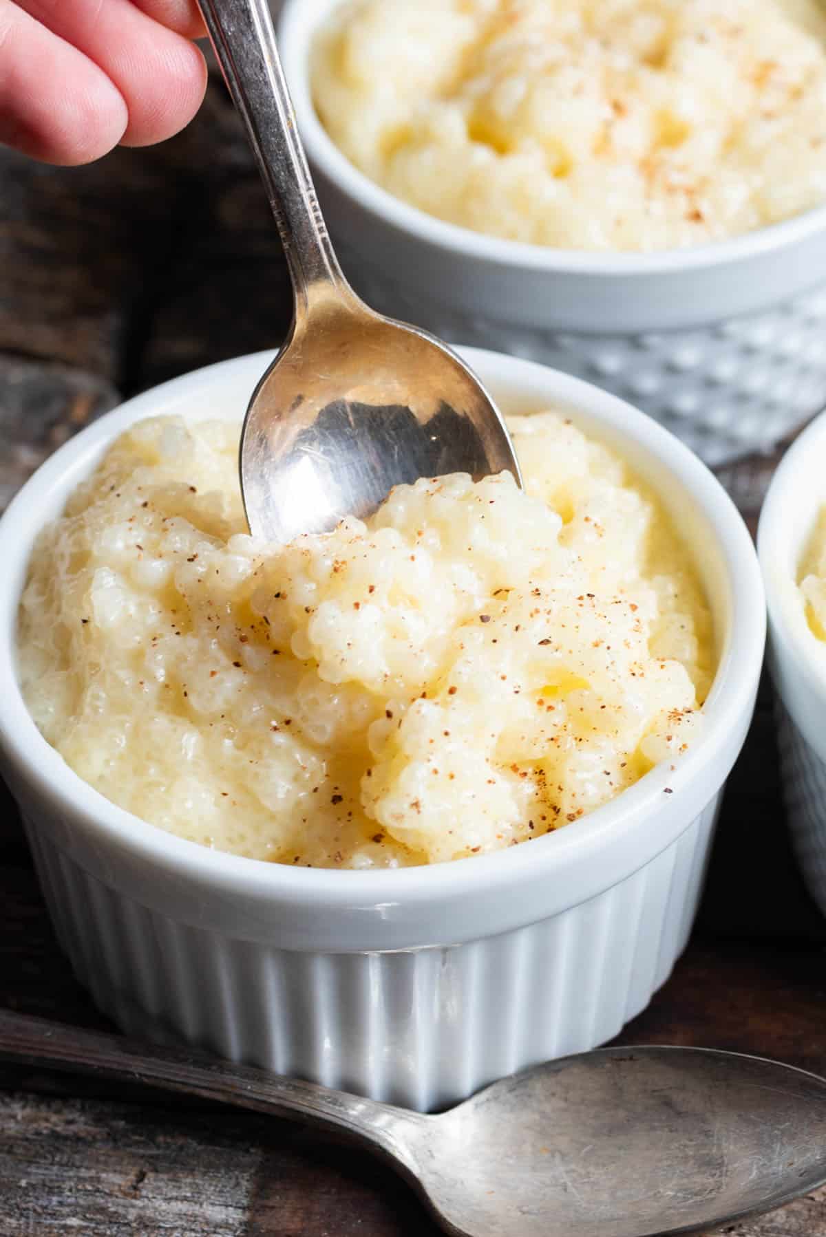 a spoon in a cup of instant tapioca pudding