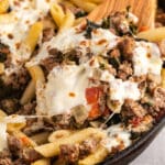 kale tomato pasta in a pan