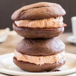 two mocha whoopie pies on a plate