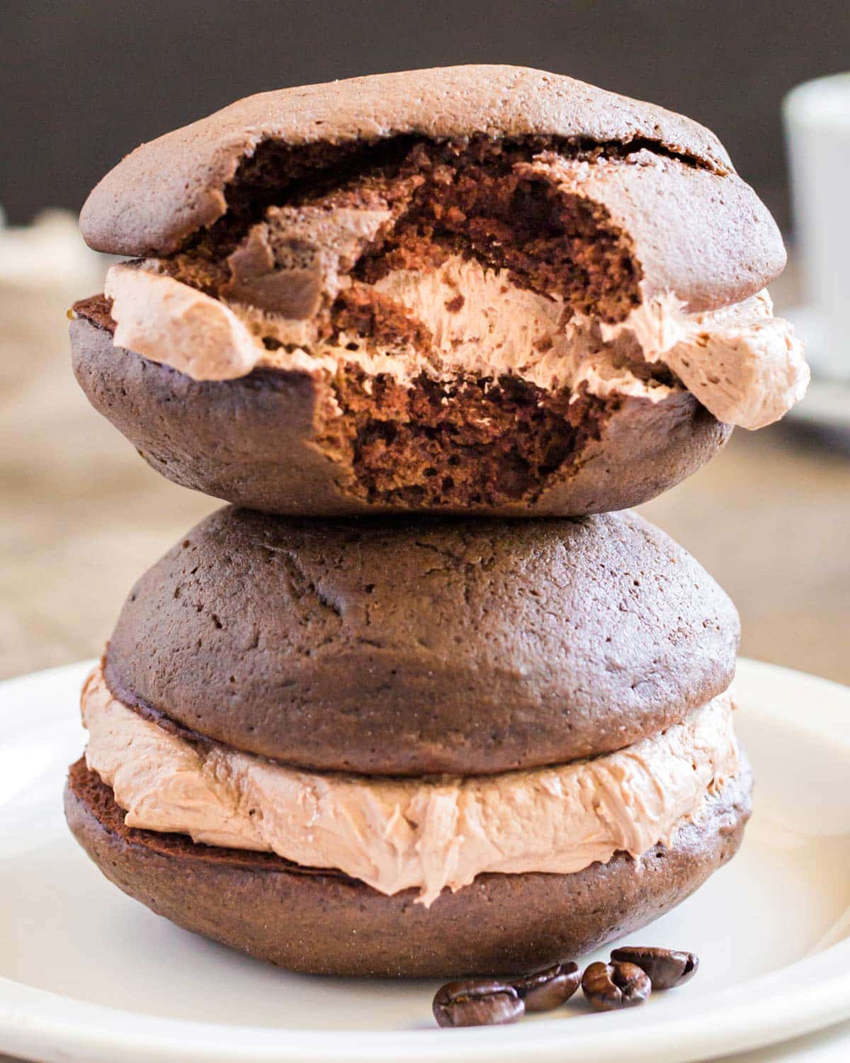 two mocha whoopie pies, one with a bite out