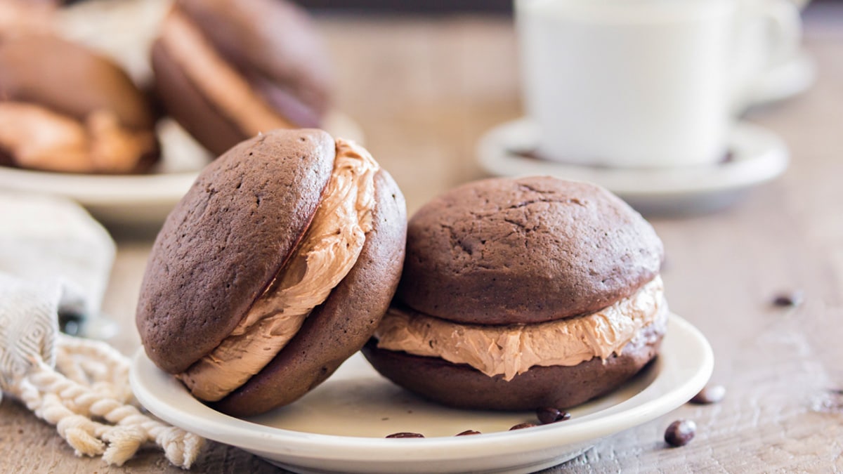 two chocolate whoopie pies on a plate