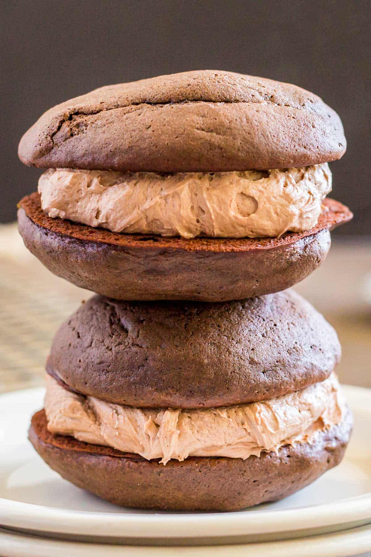 two mocha whoopie pies on a plate