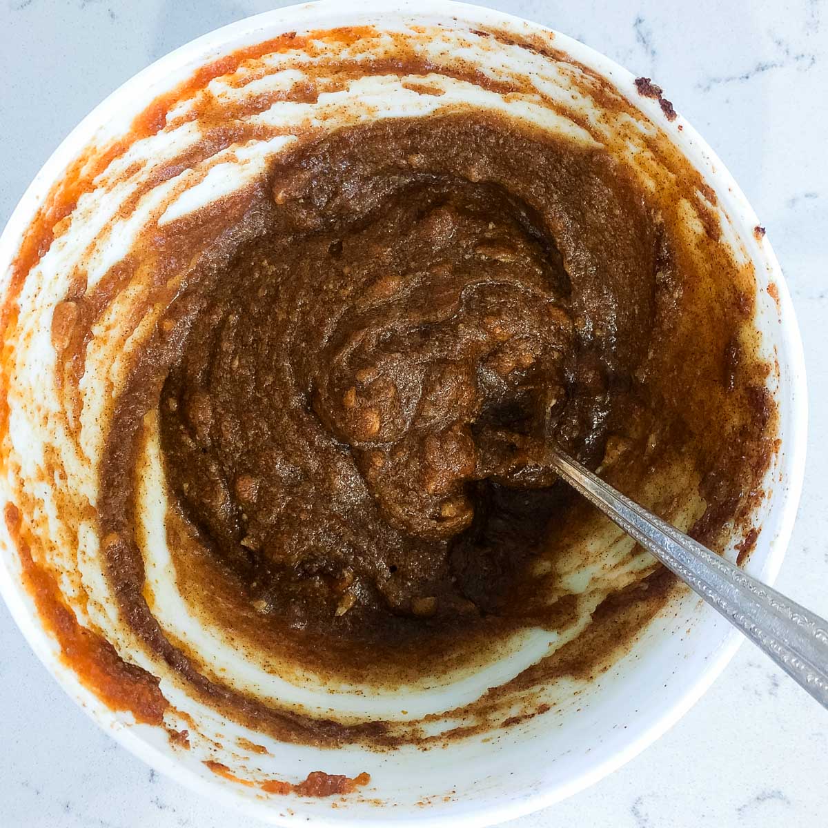 a bowl of cinnamon sugar filling for cinnamon rolls