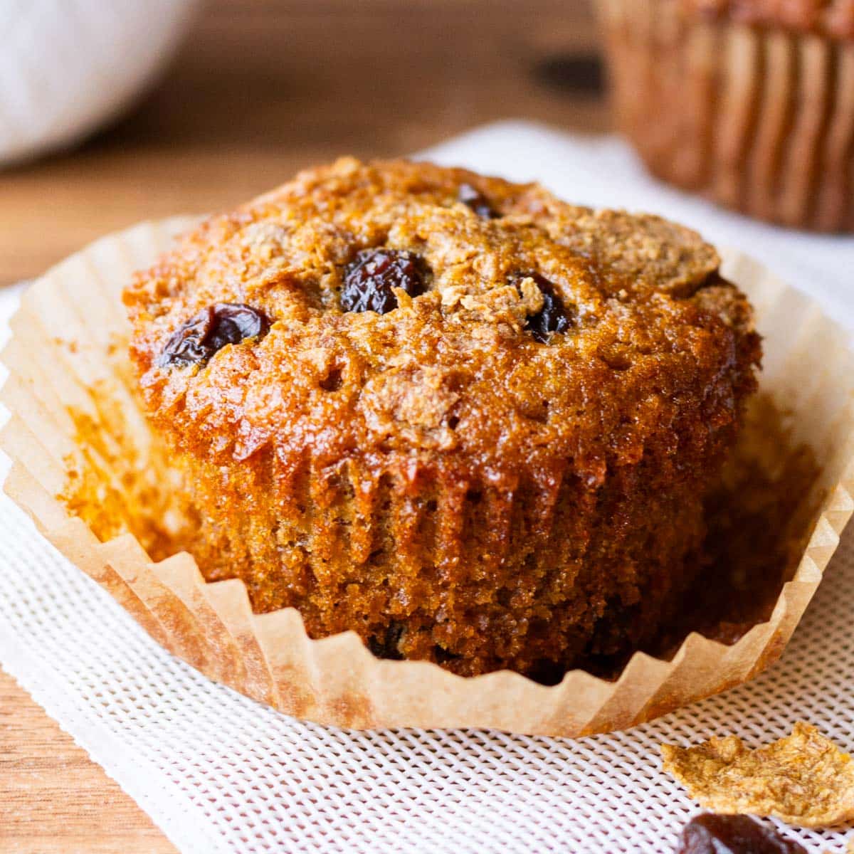 a raisin bran muffin in a muffin wrapper