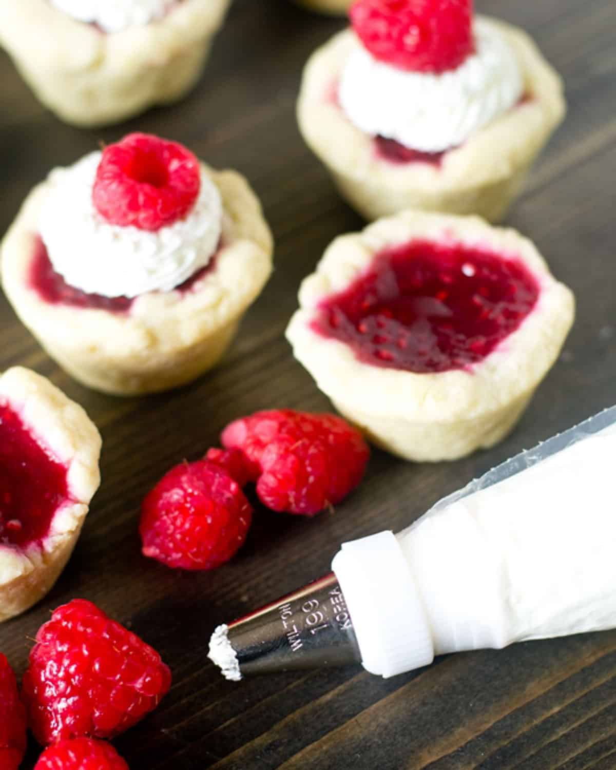 mascarpone cream in a piping bag for raspberry tarts