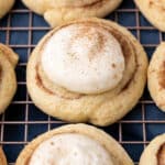 cinnamon roll cookies with a dollop of frosting