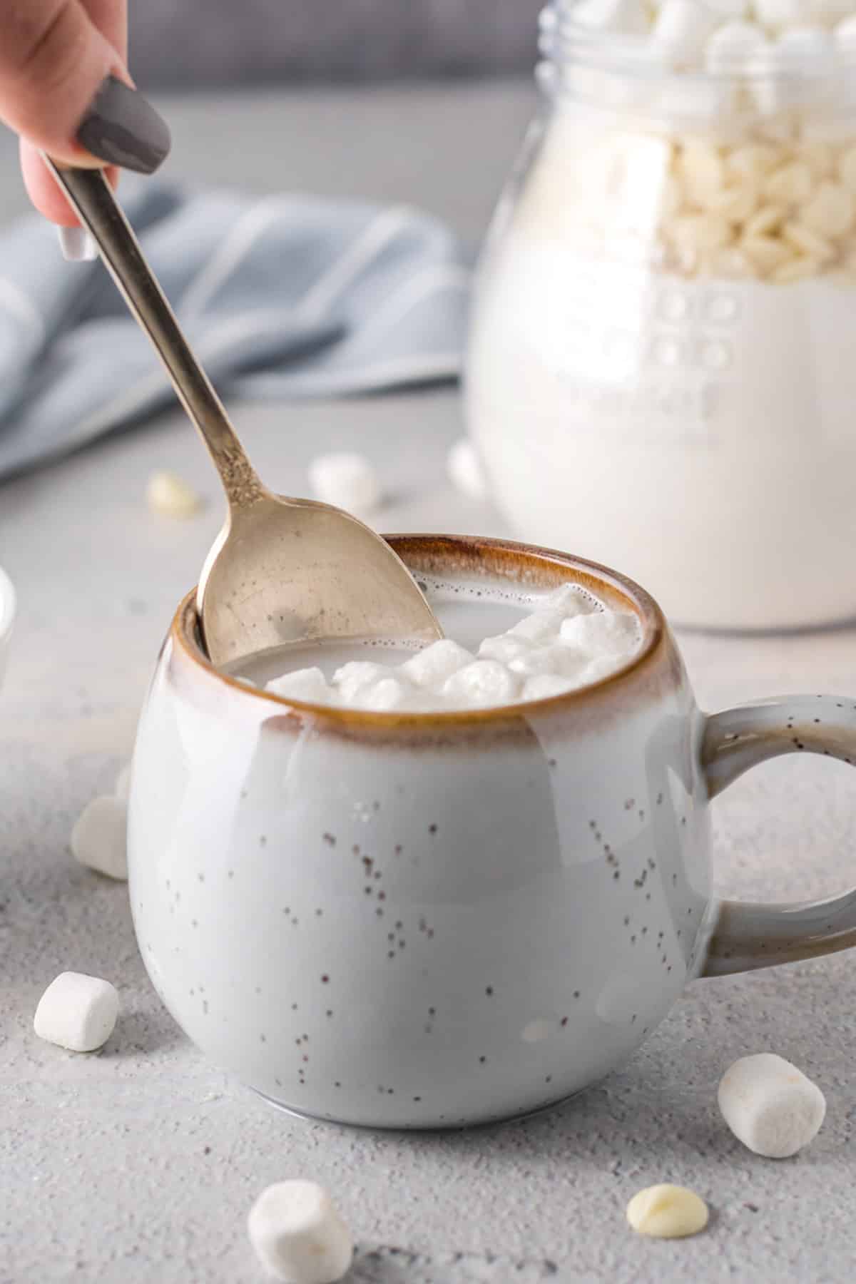 stirring white hot chocolate mix