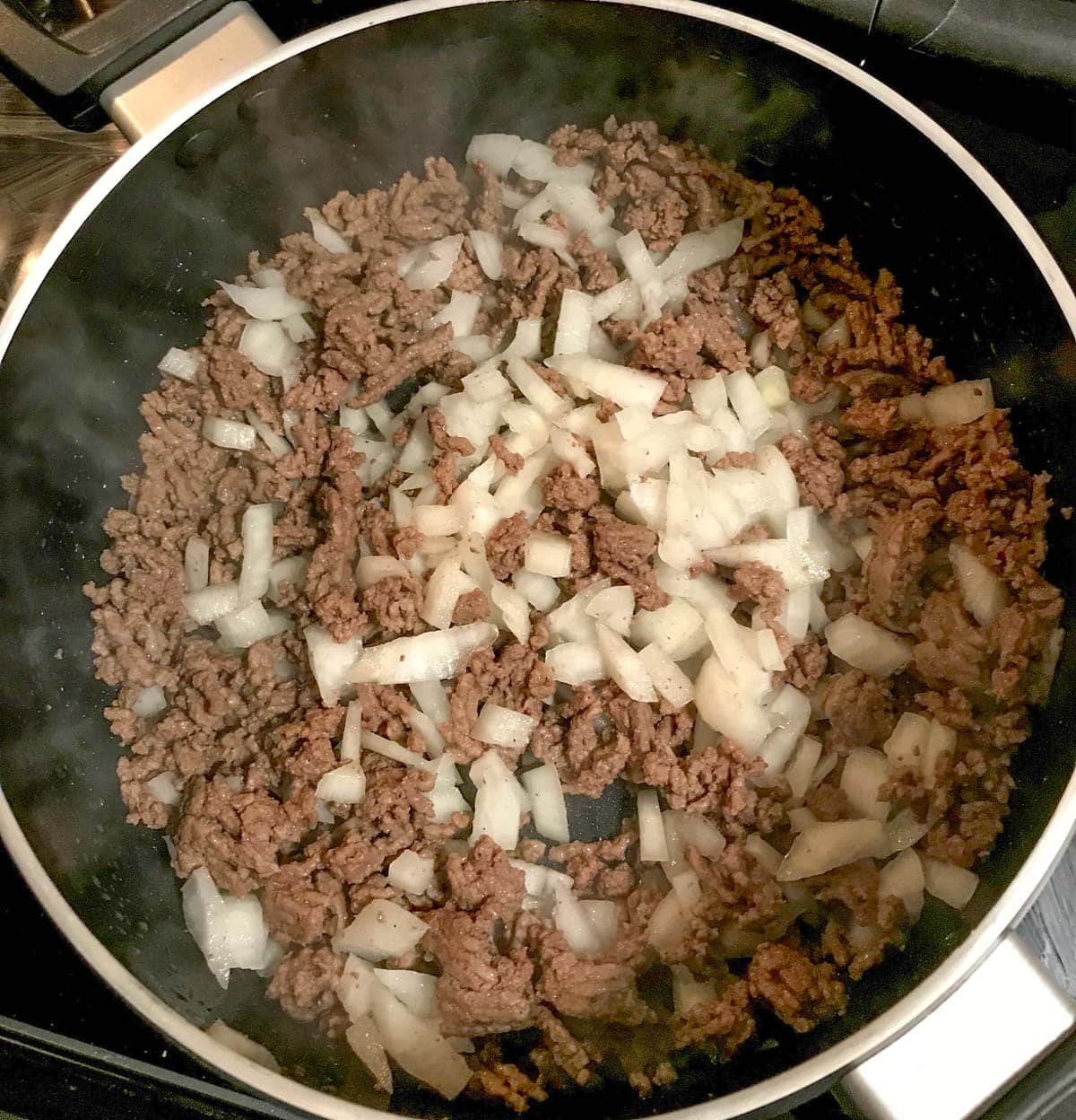 ground beef and onions in a skillet