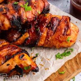 bbq bacon wrapped chicken on a table