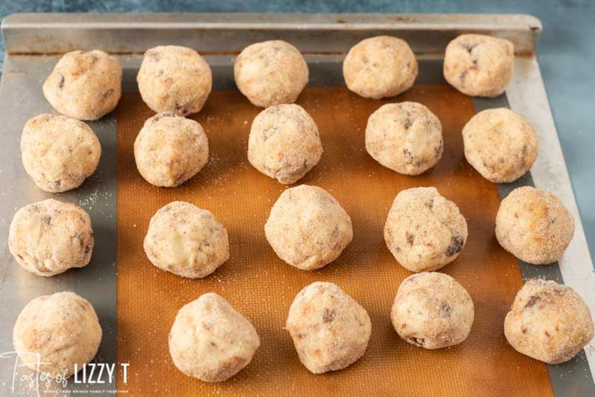 cookie dough balls on a baking sheet