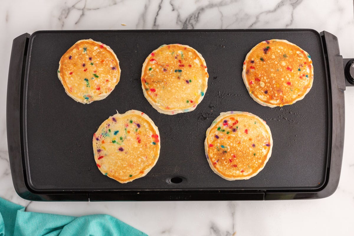 cooked pancakes on a griddle