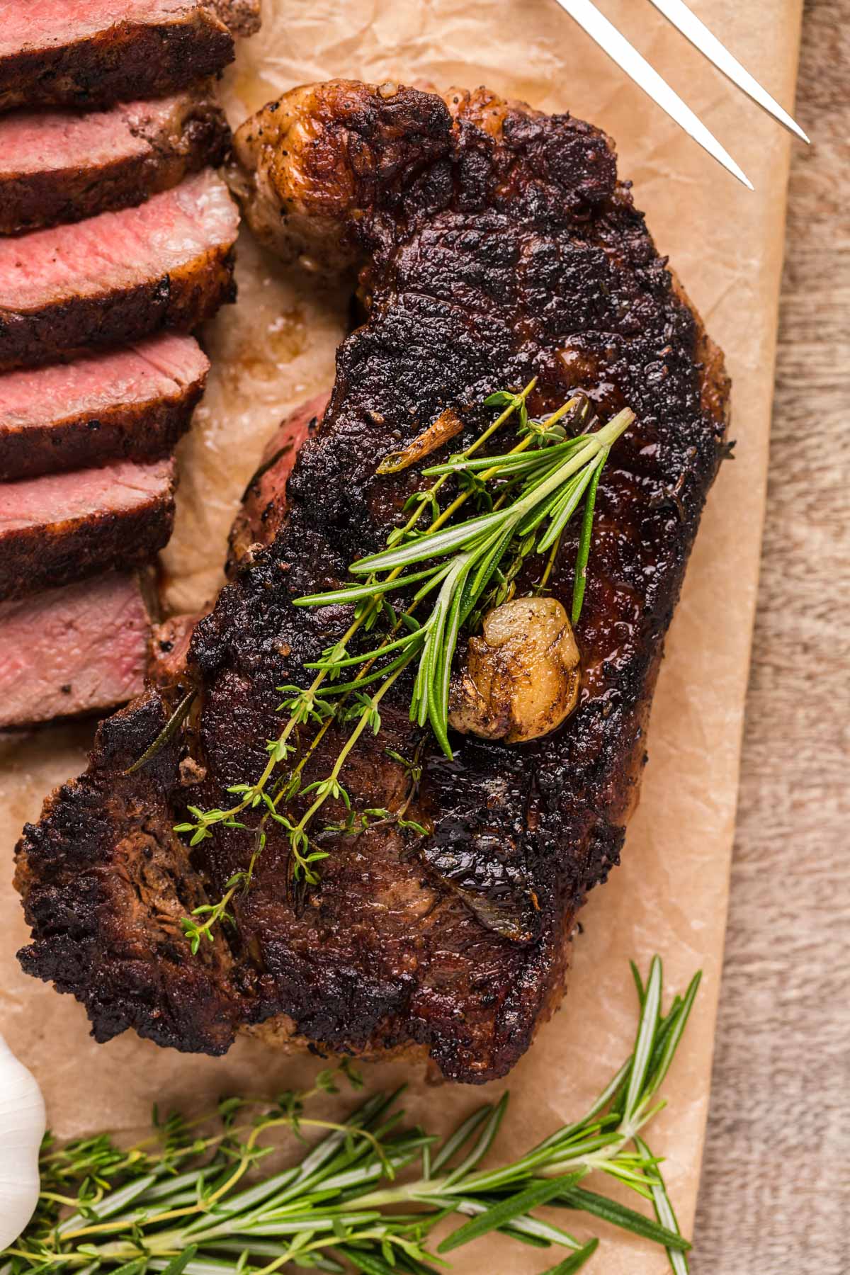 overhead view of garlic butter steak with NY strip steak