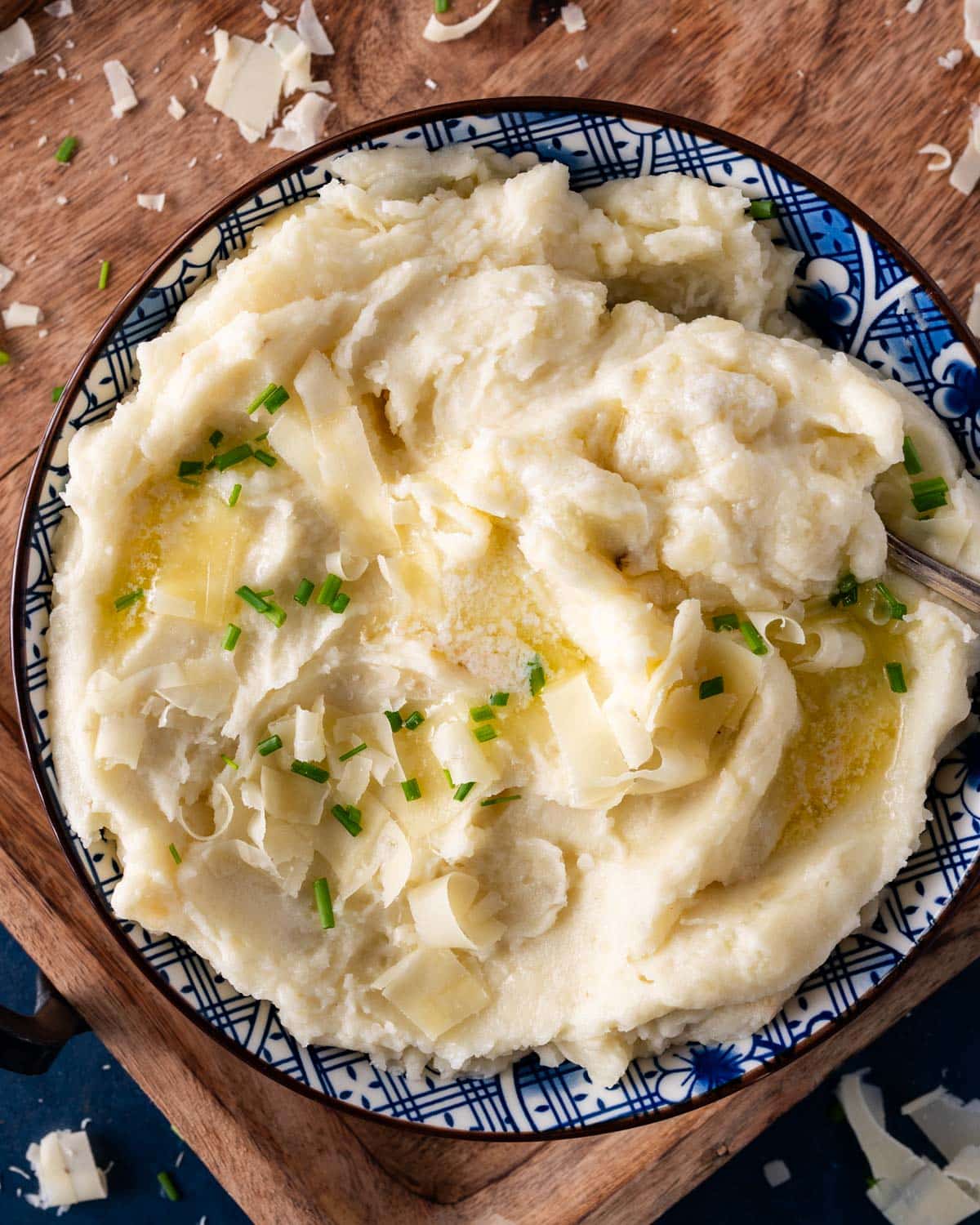 overhead view of a bowl of mashed potatoes with gruyere cheese