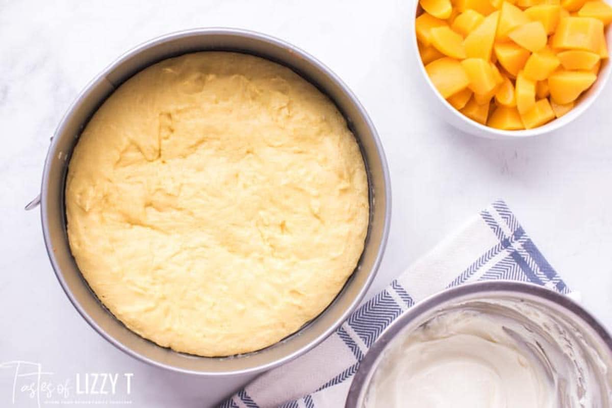 crust for peach cake in a round cake pan