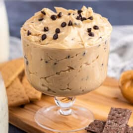 a bowl of peanut butter cheesecake dip