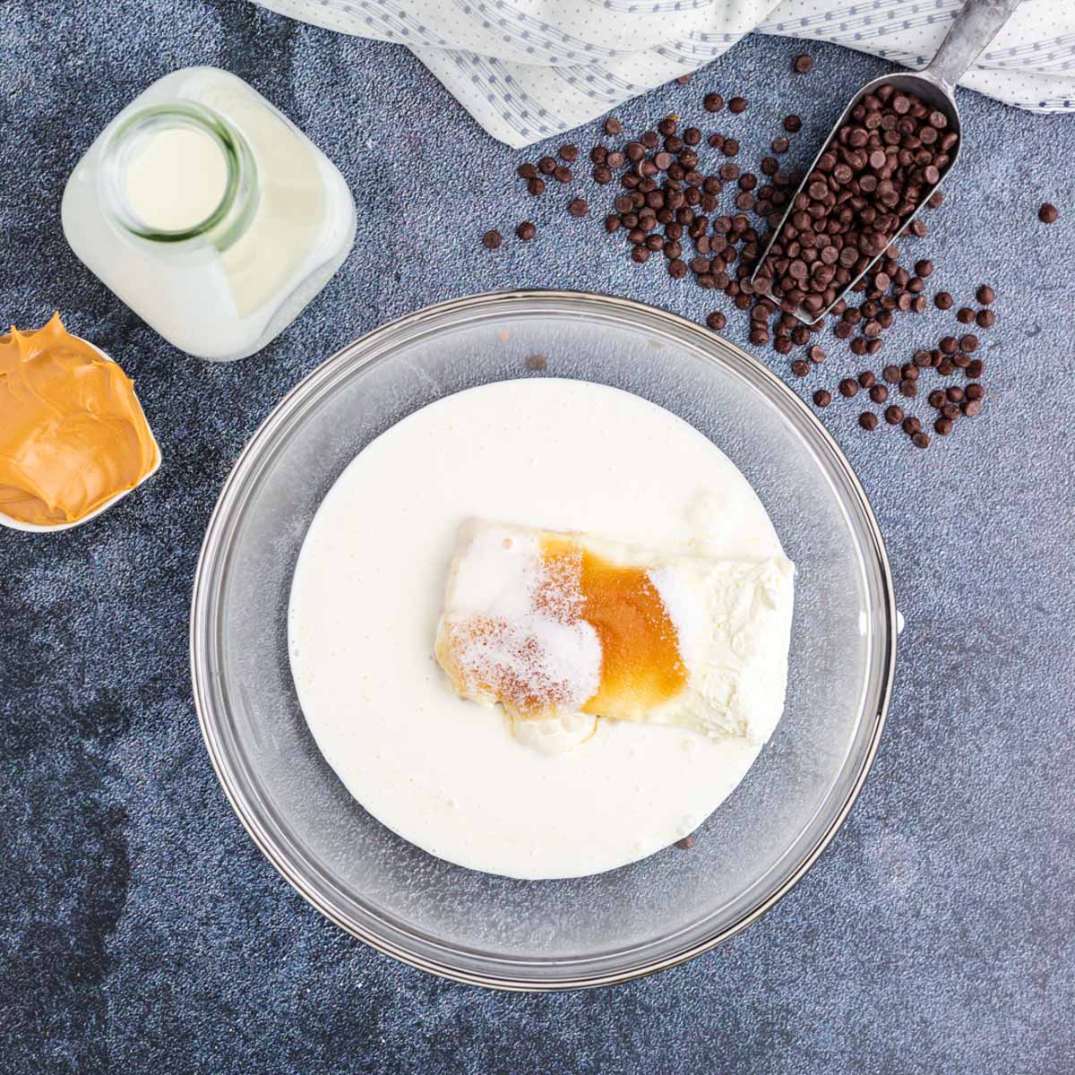 cream cheese and heavy cream in a bowl