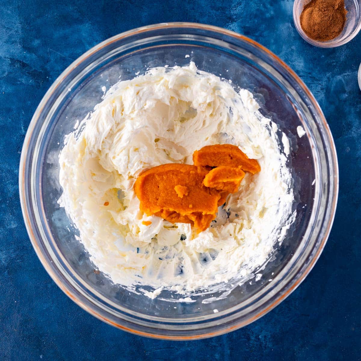 whipped cream cheese with pumpkin on top in a bowl